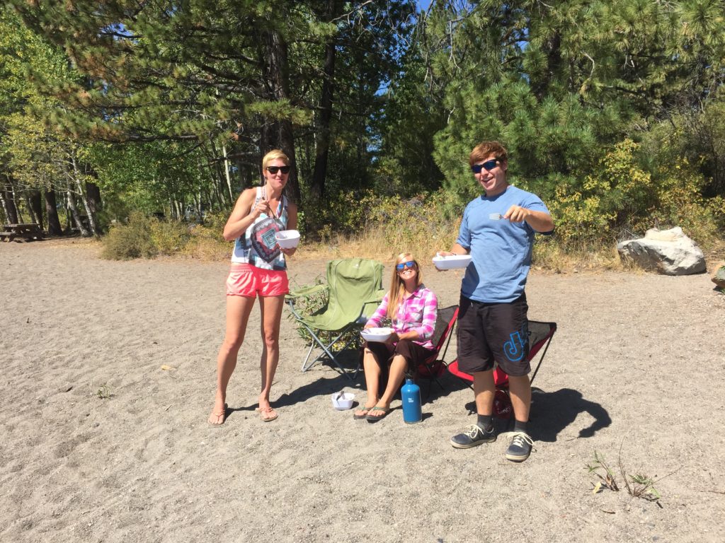 Eating a paleo car camping meal on the beach